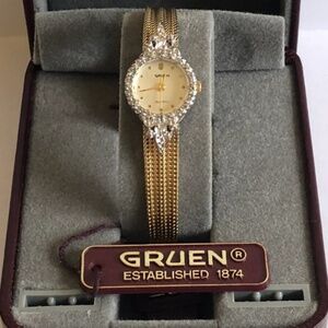 Authentic vintage Gruen women's luxury gold and diamond bezel quartz watch